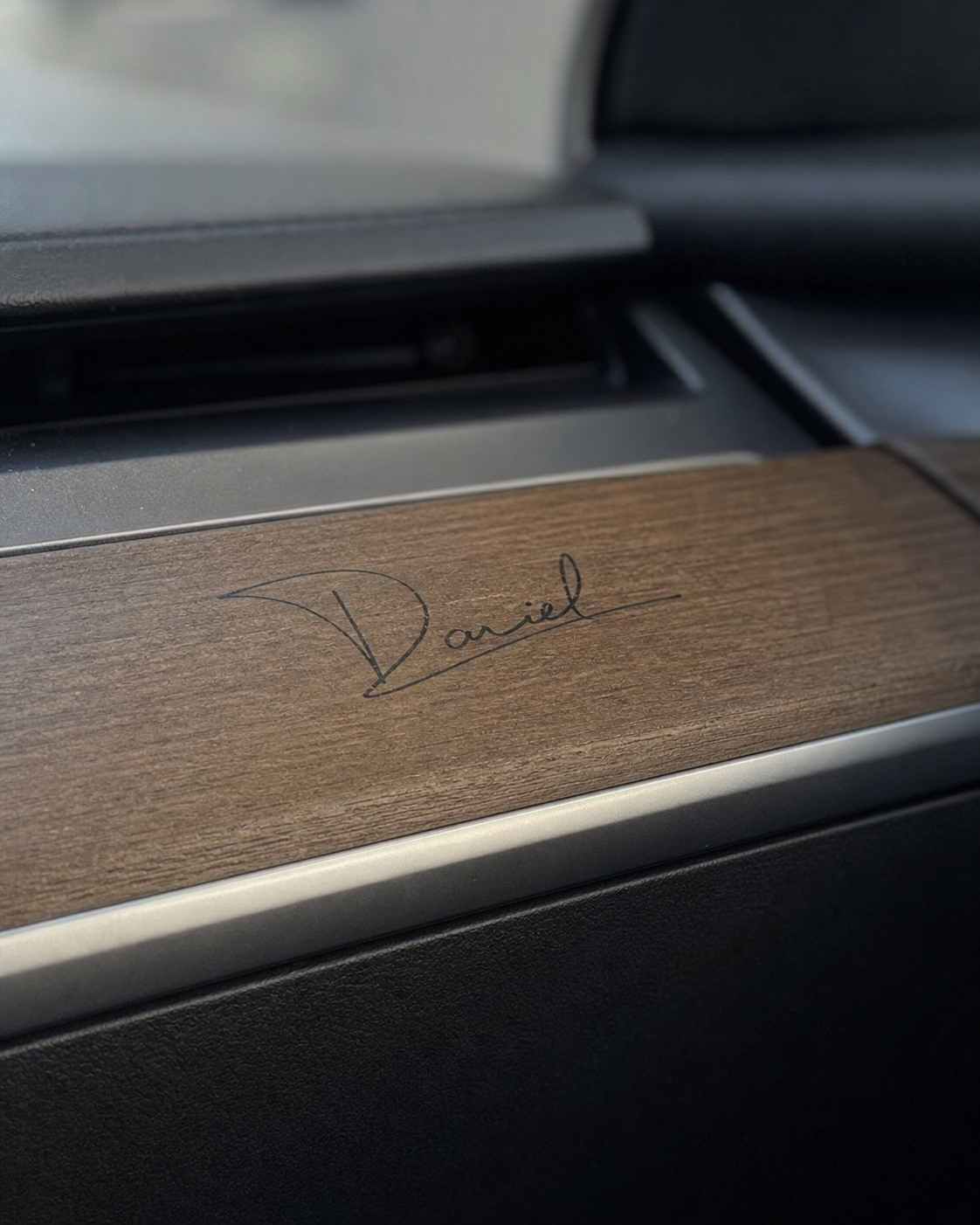 Daniel signature applied to wood dashboard trim