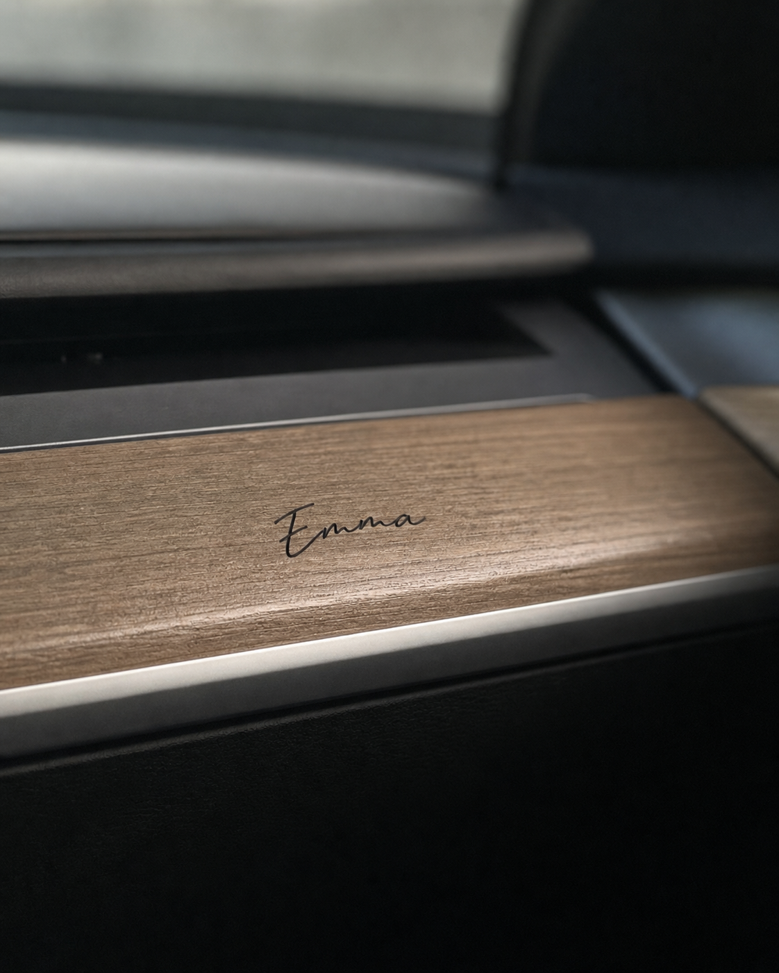 Emma signature applied to wood dashboard trim