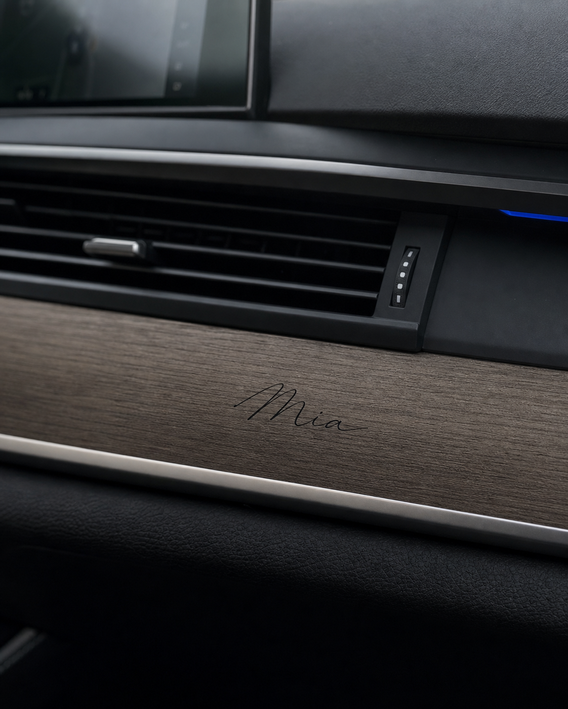 Mia signature applied to wood dashboard trim
