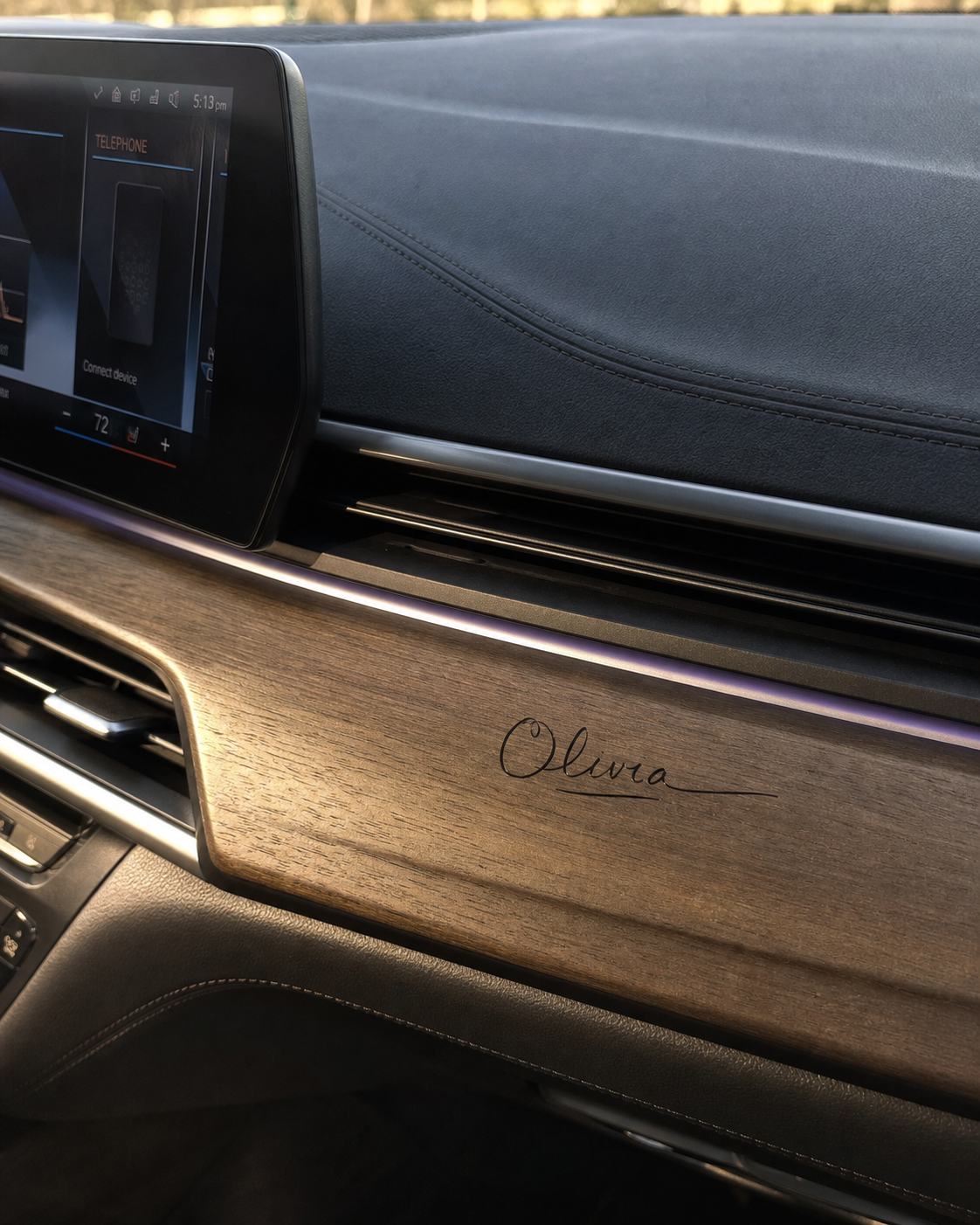 Olivia signature applied to wood dashboard trim