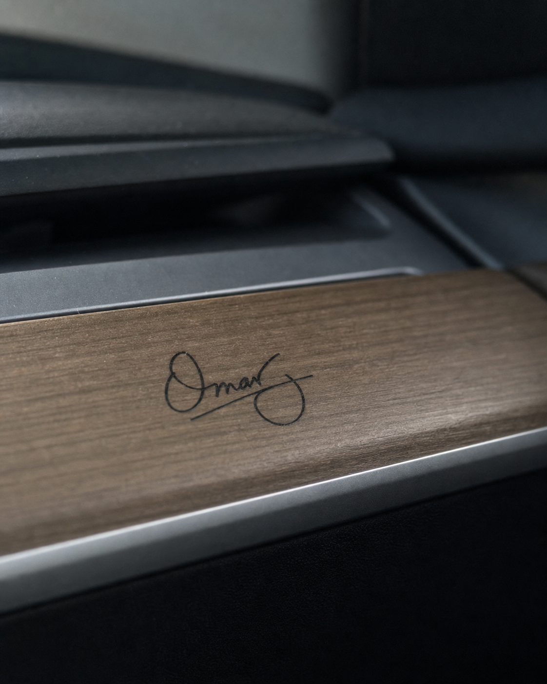 Omar signature applied to wood dashboard trim