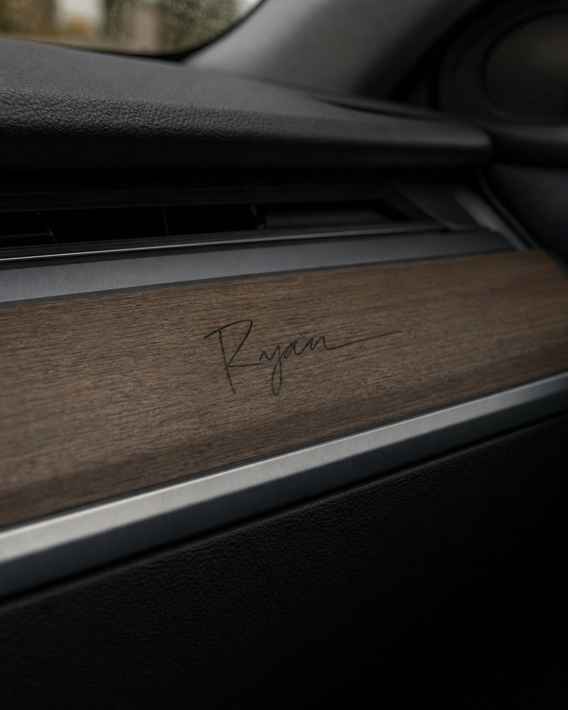 Ryan signature applied to wood dashboard trim